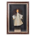 A PAPIER-MÂCHÉ DOLL, HAMBURG, GERMANY, EARLY 20TH CENTURY with brown hair, wearing a lace and grey
