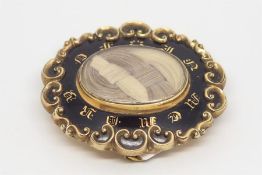 Victorian mourning brooch, black enamel 'In Memory Of' frame, woven hair centre, back engraved '