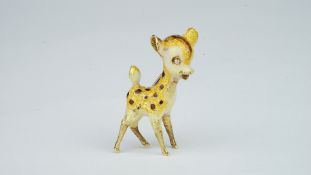 Gold and enamel deer brooch, with a single cut diamond set eye, mounted in yellow metal tested as