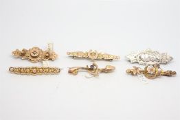 Six bar brooches, including a wishbone bar brooch, two horseshoe bar brooches, and a seed pearl