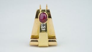 French Art Deco ruby and diamond clip, oval cabochon cut ruby measuring 9.4 x 6.6mm, with two square