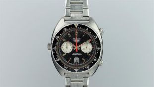 GENTLEMEN'S HEUER AUTAVIA STAINLESS STEEL CHRONOGRAPH REF. 11630, circular black dial with twin