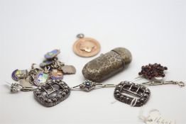Selection of jewellery including a sterling silver medal pendant, a garnet star brooch, a silver