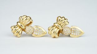 A pair of quality diamond set bow earrings, gold work bow with diamond set drops, can be worn as