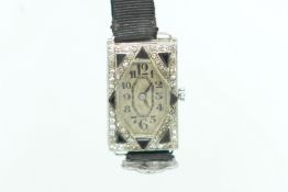 Art Deco onyx and diamond cocktail watch, octagonal dial with Arabic numerals, in a rectangular