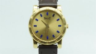 Ladies' Piaget 18ct Gold Wristwatch, circular champagne dial with blue enamel markers, outer black