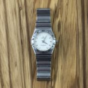 Ladies Omega Constellation, circular white dial, baton hour markers, stainless steel case and