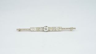 Diamond bar brooch, central old mine cut diamond weighing 1.31ct , with four old cut diamonds to