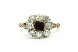 Garnet and diamond ring, central square garnet disc, surrounded by old cut diamonds, (two stones are