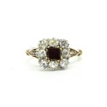 Garnet and diamond ring, central square garnet disc, surrounded by old cut diamonds, (two stones are