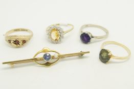 A selection of jewellery including a single stone amethyst ring in 18ct gold, a single green stone