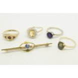A selection of jewellery including a single stone amethyst ring in 18ct gold, a single green stone