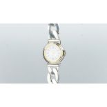 A French silver watch bracelet, round dial signed Clio Blue, with Roman numerals and date