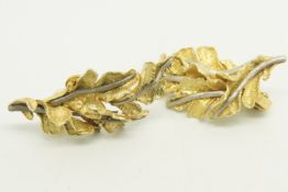 Pair of yellow metal earrings, designed as textured leaves, tested as 18ct, with post and clip