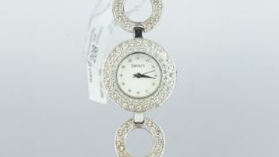 LADIES' DKNY WRISTWATCH, white dial, set with stones, stainless steel case and bracelet.