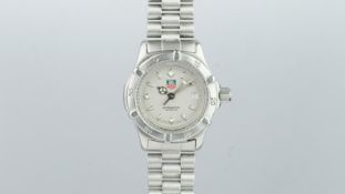 LADIES' TAG HEUER PROFESSIONAL STAINLESS STEEL REF. WE1411-2, silver dial date aperture at 3, 29mm