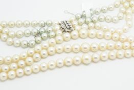 Three row cultured freshwater pearl necklace, three graduated rows, each row with graduated cream