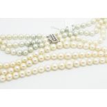 Three row cultured freshwater pearl necklace, three graduated rows, each row with graduated cream