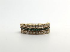Emerald sapphire and diamond 'day and night' eternity band, mounted in yellow metal, ring size N1/2