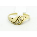 Diamond twist ring, set with round brilliant cut diamonds, mounted in yellow metal stamped 18ct,