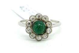 Early 20th Century emerald and diamond ring, central cabochon cut emerald, surrounded by old cut