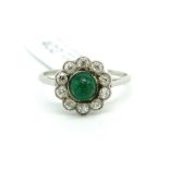 Early 20th Century emerald and diamond ring, central cabochon cut emerald, surrounded by old cut