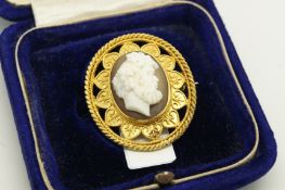 Cameo brooch, hardstone cameo of a gentleman, within a yellow metal ornate surround, stamped 18ct,