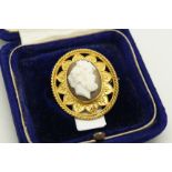 Cameo brooch, hardstone cameo of a gentleman, within a yellow metal ornate surround, stamped 18ct,