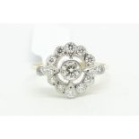 Diamond target cluster ring, set with round brilliant cut diamonds weighing an estimated total of