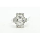 Art Deco style diamond ring, central vertical panel set with two round brilliant cut diamonds,