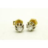 Pair of single stone diamond stud earrings, old cut diamonds weighing an estimated total of 0.
