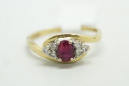 Ruby and diamond ring, central oval cut ruby, set with three round brilliant cut diamonds to each