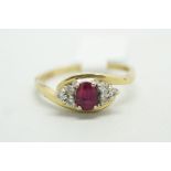Ruby and diamond ring, central oval cut ruby, set with three round brilliant cut diamonds to each