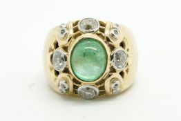 Emerald and diamond ring, central cabochon cut emerald measuring 9.45 x 7.41 x 5.66mm, with an old