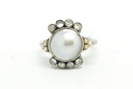 Pearl and diamond ring, central blister pearl, with three seed pearls to each side and four old