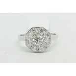 Diamond cluster ring, round brilliant cut diamonds, pave set in an octagonal panel, estimated