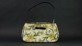 LULU GUINESS bag, yellow and green daffodils on a cream background with black patent bow detail