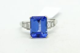 Tanzanite and diamond ring, central emerald cut tanzanite, weighing an estimated 3.00cts, with