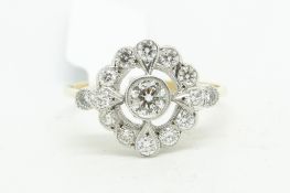 Diamond target cluster ring, set with round brilliant cut diamonds weighing an estimated total of