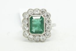 Emerald and diamond cluster ring, central step cut emerald weighing an estimated 2.25ct,