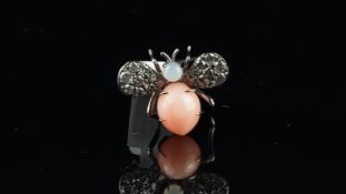 Coral, moonstone and diamond bug brooch, mounted in white metal stamped 750, measures 23 x 20mm