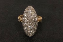 Diamond navette cluster ring, old cut diamonds in a navette panel, mounted in white and yellow
