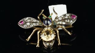 Gem set bug brooch, set with an old cut yellow stone and a cabochon cut sapphire to the body,