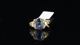 Sapphire and diamond ring, central oval cut sapphire measuring 10.8 x 6.45mm, with a larger old