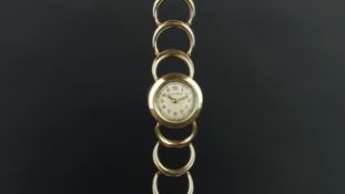 LADIES' JAEGER LE COULTRE 9CT GOLD WRISTWATCH, circular aged dial with gold hands and Arabic