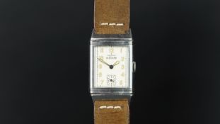 GENTLEMEN'S LE COULTRE REVERSO WRISTWATCH, rectangular off white dial with Arabic numerals with a