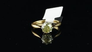 Single stone diamond ring, fancy light yellow transitional cut diamond, weighing an estimated 1.