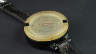 German military pilots compass, black plastic 61mm case, clear plastic rotatig top, brown leather