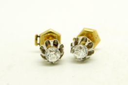 Pair of single stone diamond stud earrings, old cut diamonds weighing an estimated total of 0.