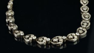 A French Victorian choker necklace, set with graduated panels of old and rose cut diamonds, the